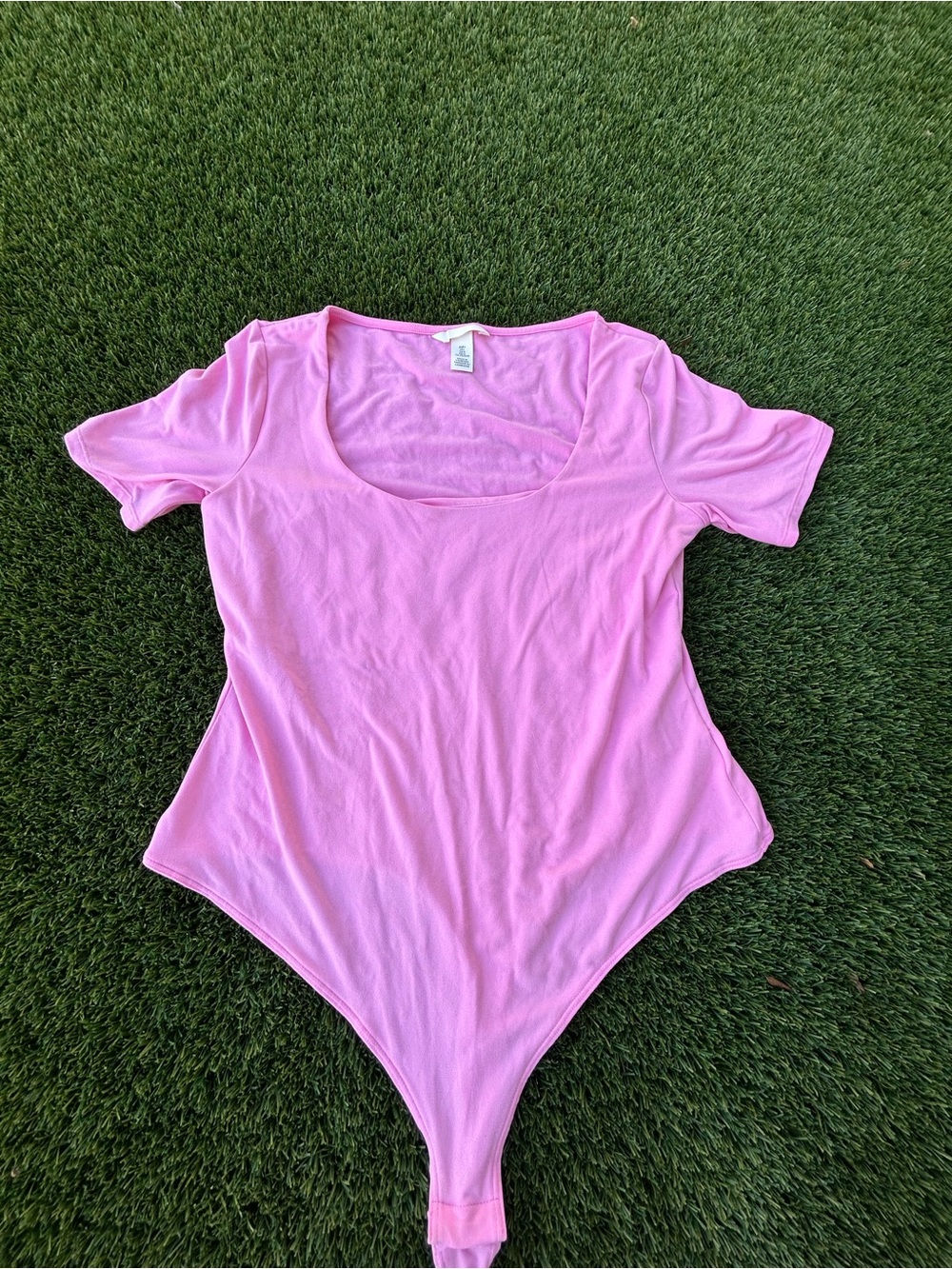 Pink body suit